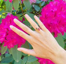 Load image into Gallery viewer, Our signature-ring is a simple, elegant, classic one with a twist, literally! The rope band with a bright and colorful gemstone makes a lovely present for a loved one or a well deserved treat for yourself. You can wear our Twisted Rings solo, but try to mix, switch, match or stack them for endless combinations! Gemstones in this picture: Amethyst and Ruby.