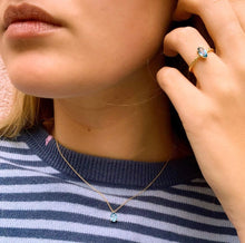 Load image into Gallery viewer, Elegant, classy, subtle, timeless but oh-so fun with this oval pendant. Layer them with all of our differents designs. Perfect for everyday, every occasion and character. We just can't get enough of these handmade necklaces with colorful handpicked gemstones. Example on this picture: London Blue Topaz. In combination with a Twisted Marquise ring.