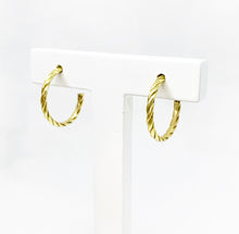 Load image into Gallery viewer,  Our hoop earrings gave a little twist to a classic must-have in your jewelry box. Such a good classic pair of 18k gold hoop earrings.
