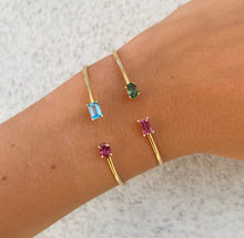 Load image into Gallery viewer, Just like you and me, toi et moi, jij en ik, this piece of fine jewelry with unique shaped gemstones is precious and special. This example is with one rectangle / emerald cut Sky Blue Topaz and one oval rhodolite. The second example is with a rectangle shaped / Emerald cut pink tourmaline and an oval green tourmaline.