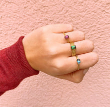 Load image into Gallery viewer, An outstanding piece of jewelry that will make you feel glamorous. Wear this day and night, from work to a party. You will never get enough of this one! Gemstone of the Triple Twisted Rectangle ring in this picture: Green Tourmaline.