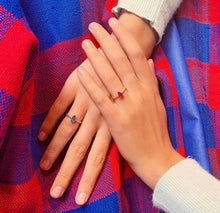 Load image into Gallery viewer, Our signature-ring is a simple, elegant, classic one with a twist, literally! The rope band with a bright and colorful gemstone makes a lovely present for a loved one or a well deserved treat for yourself. You can wear our Twisted Rings solo, but try to mix, switch, match or stack them for endless combinations! Gemstones in this picture: Ruby and Iolite.