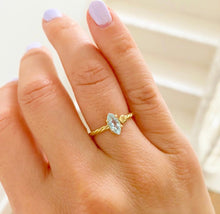 Load image into Gallery viewer, Jewelry with a special meaning is powerful, especially when it's personalized. Our twisted ring with one or two initials makes the perfect gift for your loved one. Gemstone in this picture: Sky Blue Topaz.