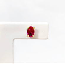 Load image into Gallery viewer, It's all in the details! Our studs are available in different colors. Choose your favorite colorful gemstone for that extra sparkle. Fine jewelry is fun and so are our studs. You can mix and match them with every other piece of our earring collection. Perfect as a first pair of earrings or small gift. Wear our studs individually or pared, it's up to you! Oval rhodolite earrings are timeless.