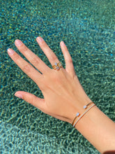 Load image into Gallery viewer, Our Twisted Ring with Lab Grown Diamond. These one is the ultimate expression of love. So if you're ready to pop THAT question, we got you! This 18k gold Twisted ring with a Lab Grown Diamond makes also the perfect gift for yourself to symbolize self-love.