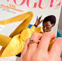 Load image into Gallery viewer, This one is a classic model but made modern with bright colorful gemstones.The big gemstone in the middle is an eye-catcher defined by the two sidestones. A beautiful statement piece! Choose two colors to personalize this classic piece of fine jewelry. You'll keep this three stones ring forever cause this one never goes out of style!  This one has an Amethyst as a centre strone and two peridot side stones.