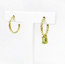 Load image into Gallery viewer,  Our hoop earrings gave a little twist to a classic must-have in your jewelry box. Want that extra sparkle? Just add a pendant or two and try never-ending combinations. Gemstone in this picture: Peridot.