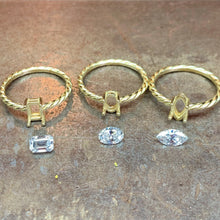 Load image into Gallery viewer, Our Twisted Ring with Lab Grown Diamond. This one is the ultimate expression of love. So if you're ready to pop THAT question, we got you! This 18k gold Twisted ring with a Lab Grown Diamond makes also the perfect gift for yourself to symbolize self-love. Emerald, Oval and Marquise cut in this picture.