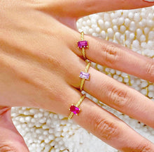 Load image into Gallery viewer, Our signature-ring is a simple, elegant, classic one with a twist, literally! The twisted band with a bright and colorful gemstone makes a lovely present for a loved one or a well deserved treat for yourself. You can wear our Twisted Rings solo, but try to mix, switch, match or stack them for endless combinations! Gemstone in this picture: Rhodolite, Amethyst and Ruby