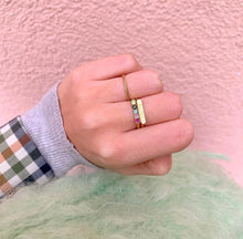 Load image into Gallery viewer, Horizontal signet ring. Ring with five colorful gemstones. Ruby, pink tourmaline, sky blue topaz, green tourmaline, citrine. One twisted 18k gold ring.