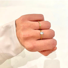 Load image into Gallery viewer, A personal gift for yourself or a present for a loved one. Engrave the letter of your first, last, or loved ones name. Subtle, elegant and timeless. Combined with our twisted ring with a Sky Blue Topaz.