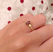 Load image into Gallery viewer, Jewelry with a special meaning is powerful, especially when it's personalized. Our twisted ring with one or two initials makes the perfect gift for your loved one. Gemstone in this picture: Rhodolite.