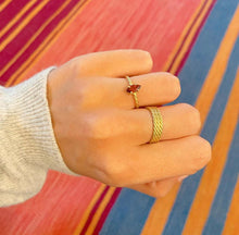 Load image into Gallery viewer, Triple twisted ring. Perfect as an extra layer to comine with your other rings and jewelry. Three Rope band rings combined in one. This one is combined with our twisted marquise ring with a garnet gemstone. The twited ring has also a rope band.