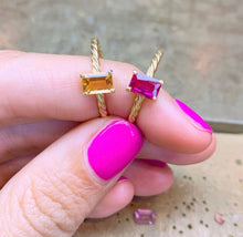 Load image into Gallery viewer, Our signature-ring is a simple, elegant, classic one with a twist, literally! The twisted band with a bright and colorful gemstone makes a lovely present for a loved one or a well deserved treat for yourself. You can wear our Twisted Rings solo, but try to mix, switch, match or stack them for endless combinations! Gemstones in this picture: Citrine and Ruby.