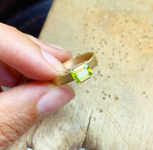 Load image into Gallery viewer, The design of our Deco Ring is inspired by the Art Deco movement. This is our modern interpretation to a classic piece. The horizontal rectangle gemstone gives this ring a powerful character. Our Deco Ring is the perfect everyday accessory.  Gemstone in this picture: Peridot.