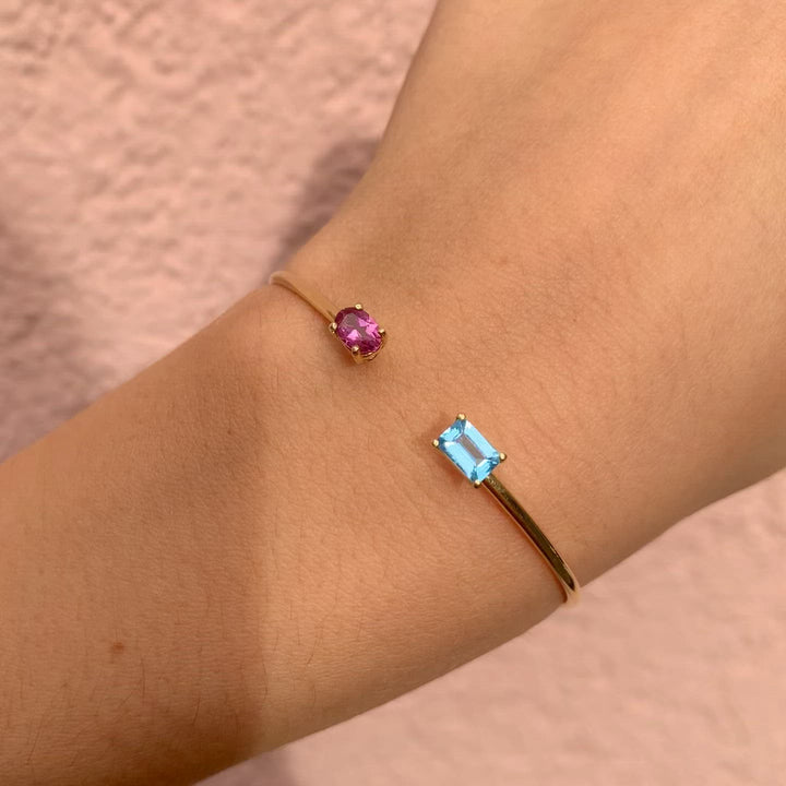This piece with two unique shaped gemstones is precious and special. Also know as the you and me, toi et moi or jij en ik ring. This example has a green tourmaline in oval cut and one pink tourmaline that is rectangle shaped / Emerald cut. Combined with the me and you bracelet. with a pink tourmaline and sky blue topaz