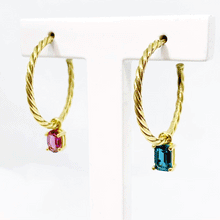 Load image into Gallery viewer, Color up our Twisted Earrings by adding a colorful gemstone to the hoop. You can mix or match different shapes for never ending combinations! This shows you the never ending examples.
