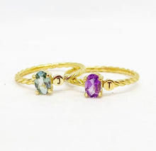 Load image into Gallery viewer, Jewelry with a special meaning is powerful, especially when it&#39;s personalized. Our twisted ring with one or two initials makes the perfect gift for your loved one. Gemstones in this picture: Sky Blue Topaz and Amethyst.
