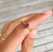 Load image into Gallery viewer, Classic solitaire design with a colorful touch. Choose one of our handpicked gemstones to create your own unique piece of fine jewelry. This shape is possible in a vertical or horizontal direction. Wear this one individually or witch, mix, match or stack this one with your other jewelry. The classic band is always a good idea but if you like a little twist but still a timeless piece, check out our rings with a twisted band. A ruby ring with emerald/rectangle cut.

